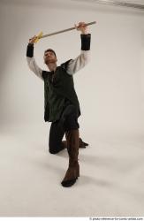 KEETA KNEELING POSE WITH SWORD